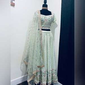 Sold-Brand new light green colour lengha Choli with Net Dupatta and heavy work